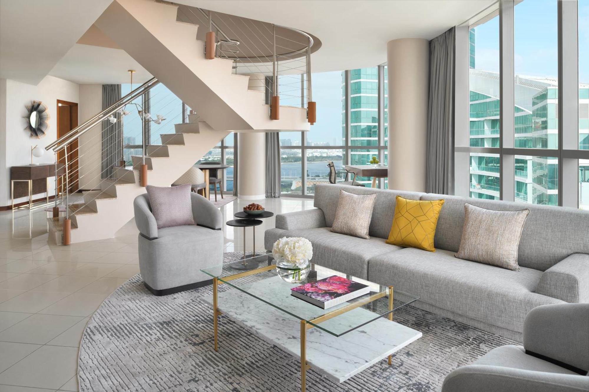 Intercontinental Residence Suites Dubai Festival City By Ihg Bagian luar foto A living room in a penthouse at The Ritz-Carlton, South Beach